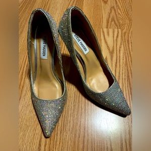 Worn once. Missing rhinestones on the inner right heel. Barely noticeable.